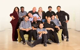 Team von Imhoff Essen bei einem gemeinsamen Gruppenfoto in moderner Location